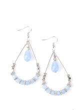 Load image into Gallery viewer, A pair of dainty silver-colored earrings with blue crystal-like beads and silver cube beads, displayed against a white background.
