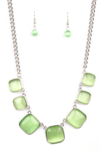 Load image into Gallery viewer, A green cat's eye stone necklace with silver fittings and a pair of matching green earrings.
